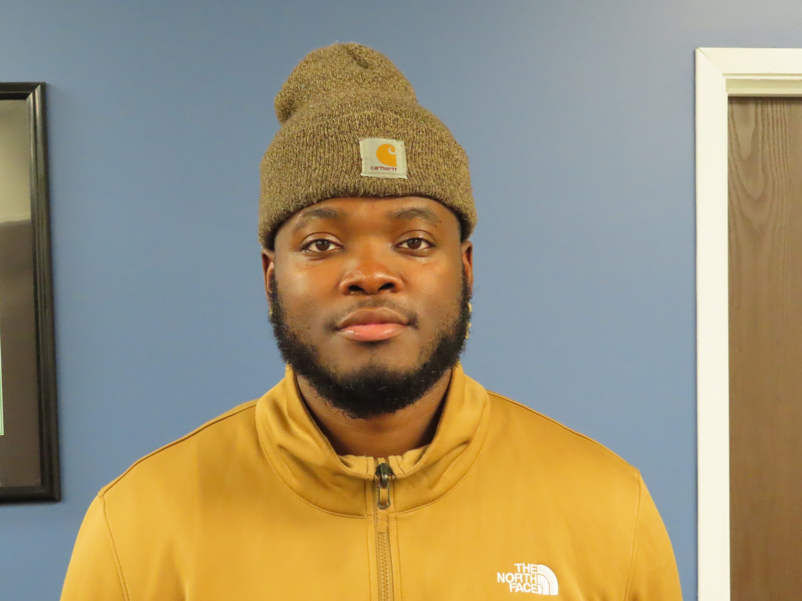 Clarence Turner, a satisfied patient, stands confidently in Horizon Physical Therapy's clinic after a successful Achilles recovery.