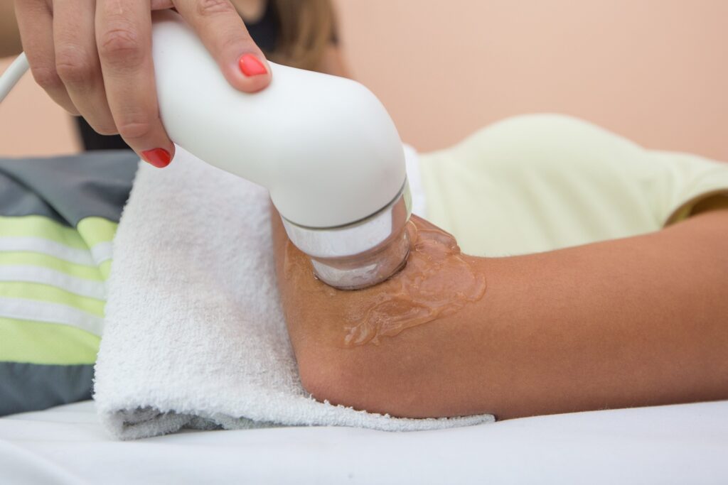 A certified hand therapist working with a patient on hand rehabilitation
