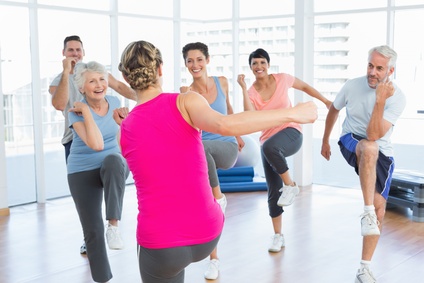 Patient working on balance and coordination exercises with physical therapy support.