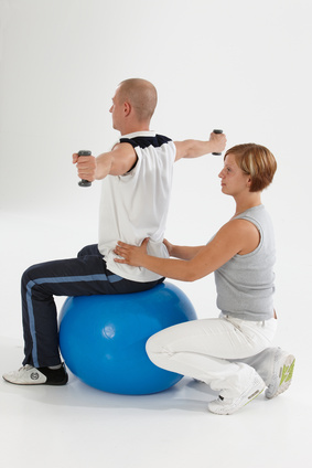 A patient performing a guided physical therapy stretch at Horizon Physical Therapy in Flint, Michigan