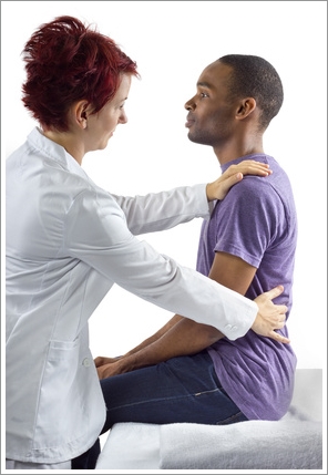 young female therapist consulting male client about posture
