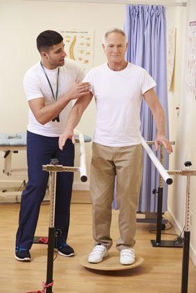 Physical therapist guiding a senior patient through balance exercises to prevent falls, available at Horizon Physical Therapy in Flint, MI