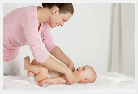 Postpartum woman performing physical therapy exercises to restore strength and mobility.